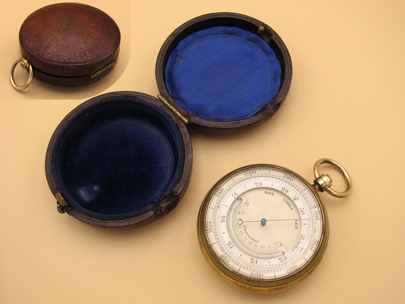 Late 19th century pocket barometer with curved thermometer in outer case